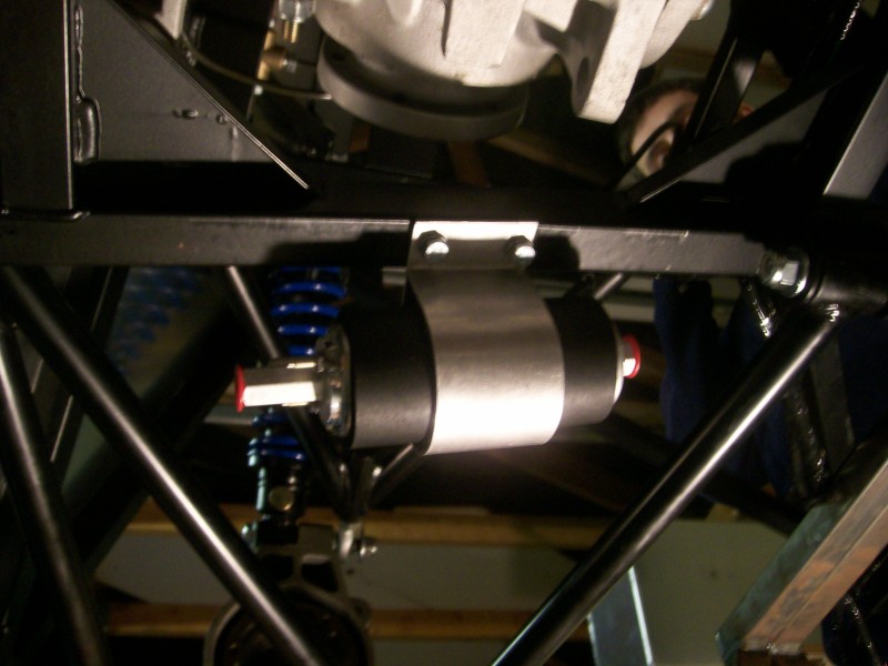 Fuel pump secured into place on the chassis inside its foam sleeve.