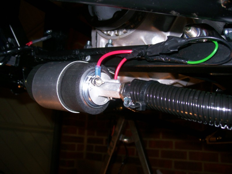 The pump connected to the loom and plumbed into the send line on the chassis.