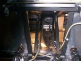 View from the rear showing both fuel lines riveted to the left hand side of the transmission tunnel