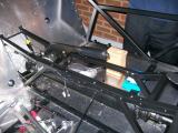 The handbrake fitted into place. There should be a 3rd cross-member by the yellow blob on the cable, but it's missing from our chassis :(