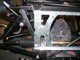 Top and bottom fixings of the radiator plate - this must now be removed to fit the cooling fan.