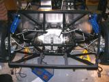 Handbrake cable run back through the chassis. Remember to cut off the grommets and place the blue sleeves under the cable ties.