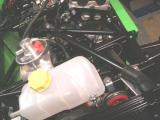 Top hose connection. It comes out of the radiator and into the thermostat housing. Cut the rubber hose to length.