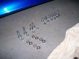 The nuts and bolts for the RAC roll bar. The collection on the right are what is used to fix the main section to the chassis. The bolts and spacers on the left are used to mount the diagonal support brackets to the main section and chassis brackets.