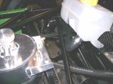 Header tank return hose - connects to the lower solid pipe.