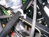 A P-clip, a long M6 bolt to go through both sides of the chassis rail, 2 washers, the spacer I made, and a bolt - job done!