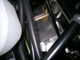 Battery tray fixed down into the floor.