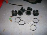 The trumpets, clamps, and the air temperature sensor removed from the standard Hayabusa airbox.