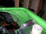 Hose connected to extend filler neck out to the bodywork.
