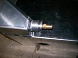 The leak is actually coming from the boss that the brass nipple is threaded into.