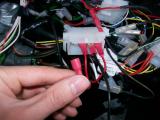 Here is the tacho block connector. The wire in my hand links to the GND connection from the tacho. I have removed this and grounded the DASH2 loom straight into the chassis which is the black wire you see connected.