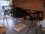 The bare space-frame chassis waiting for panel fitment.