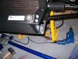 Oil cooler fitted - upper bracket fits into radiator, lower bracket fits under lower wishbone bolt.